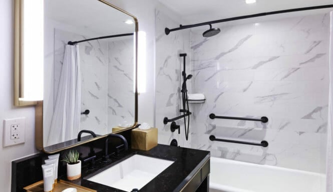Handicapped accessible bathroom with large accessible tub and vanity