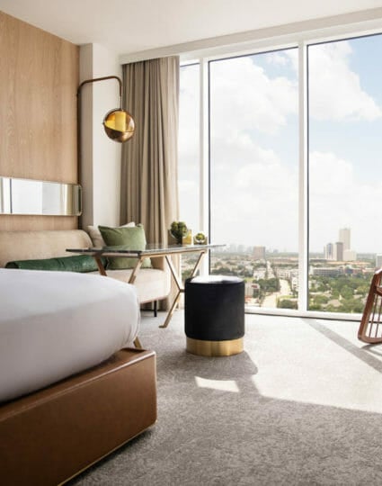 View from king bedroom with view of downtown Houston through floor to ceiling windows