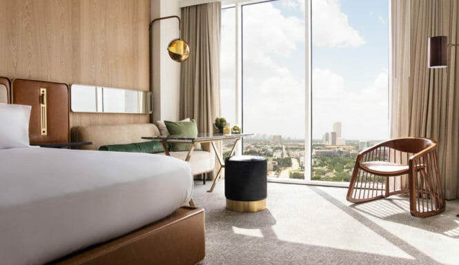 View from king bedroom with view of downtown Houston through floor to ceiling windows