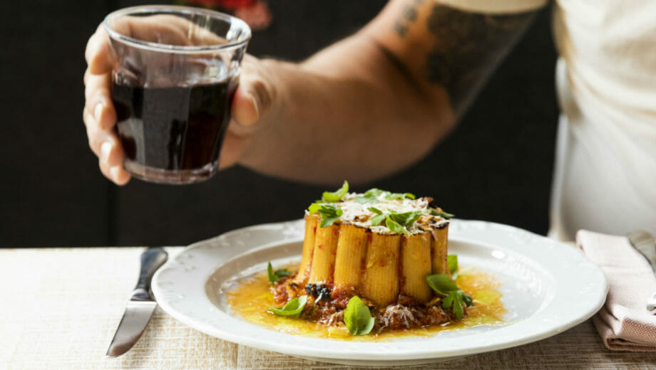 A chef garnishing a dish