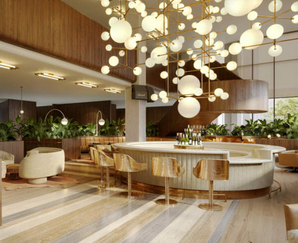 Circular bar encircled with gold bar stools and has spherical ceiling lamps
