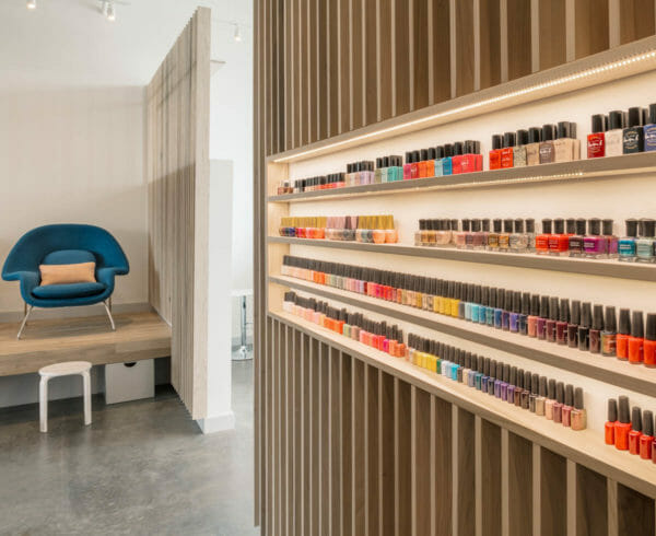 Shelves full of different colored nail polishes at Paloma Nail Salon