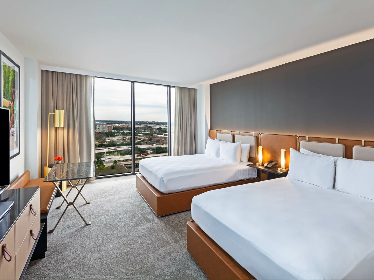 View from king bedroom with view of downtown Houston through floor to ceiling windows