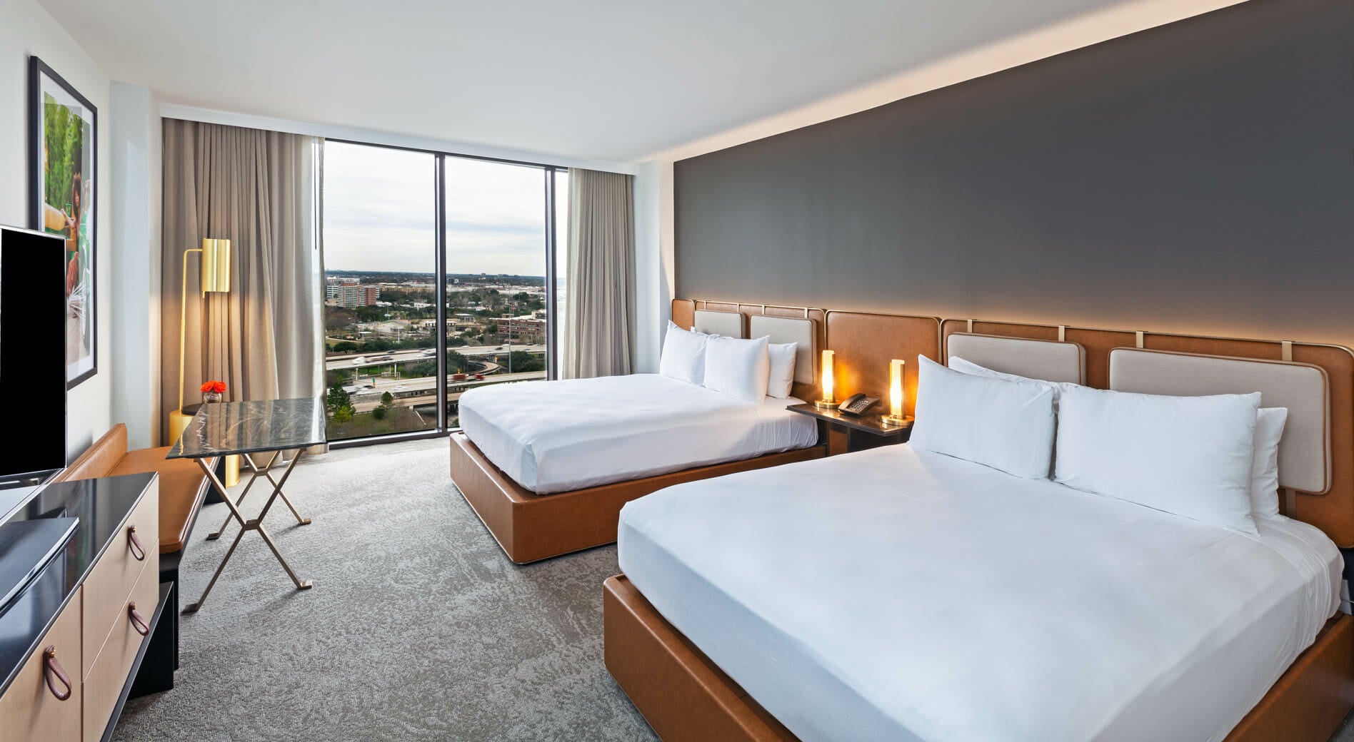 View from king bedroom with view of downtown Houston through floor to ceiling windows