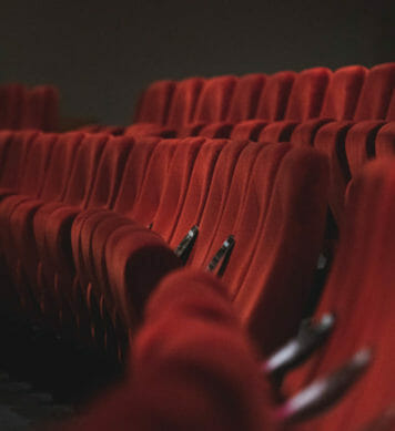 Red velvet seats in an amphitheater