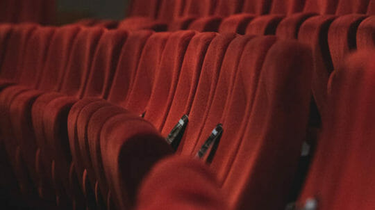 Red velvet seats in an amphitheater