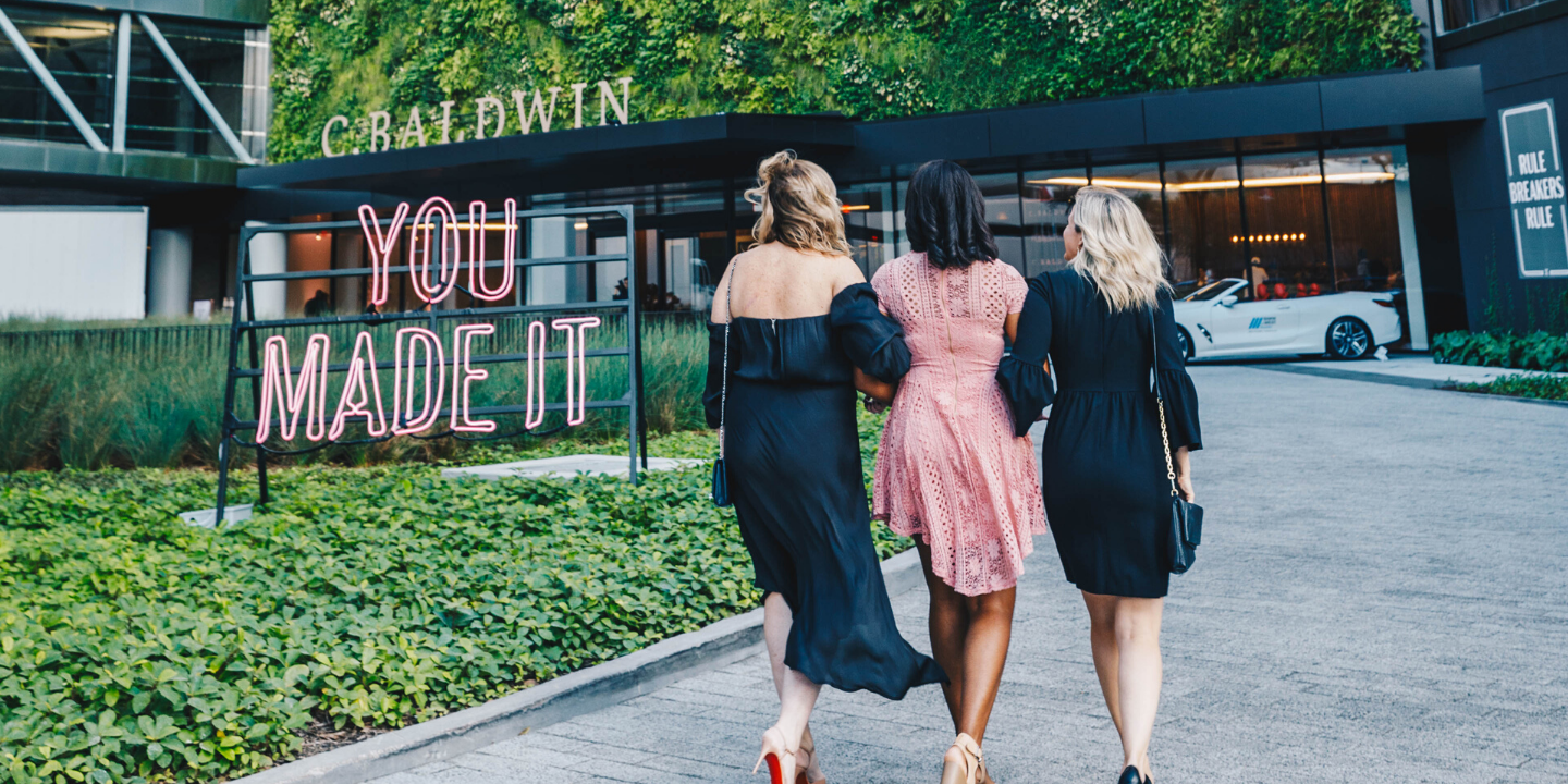 women walking into hotel