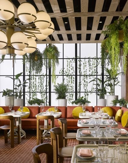 Rosalie Sunroom - filled with plants, seating and large windows