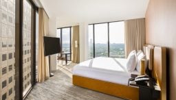 View from king bedroom with view of downtown Houston through floor to ceiling windows