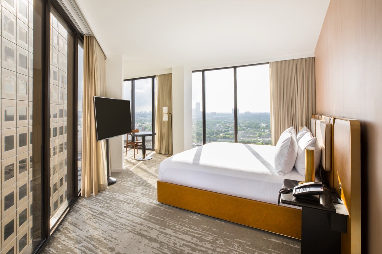 View from king bedroom with view of downtown Houston through floor to ceiling windows